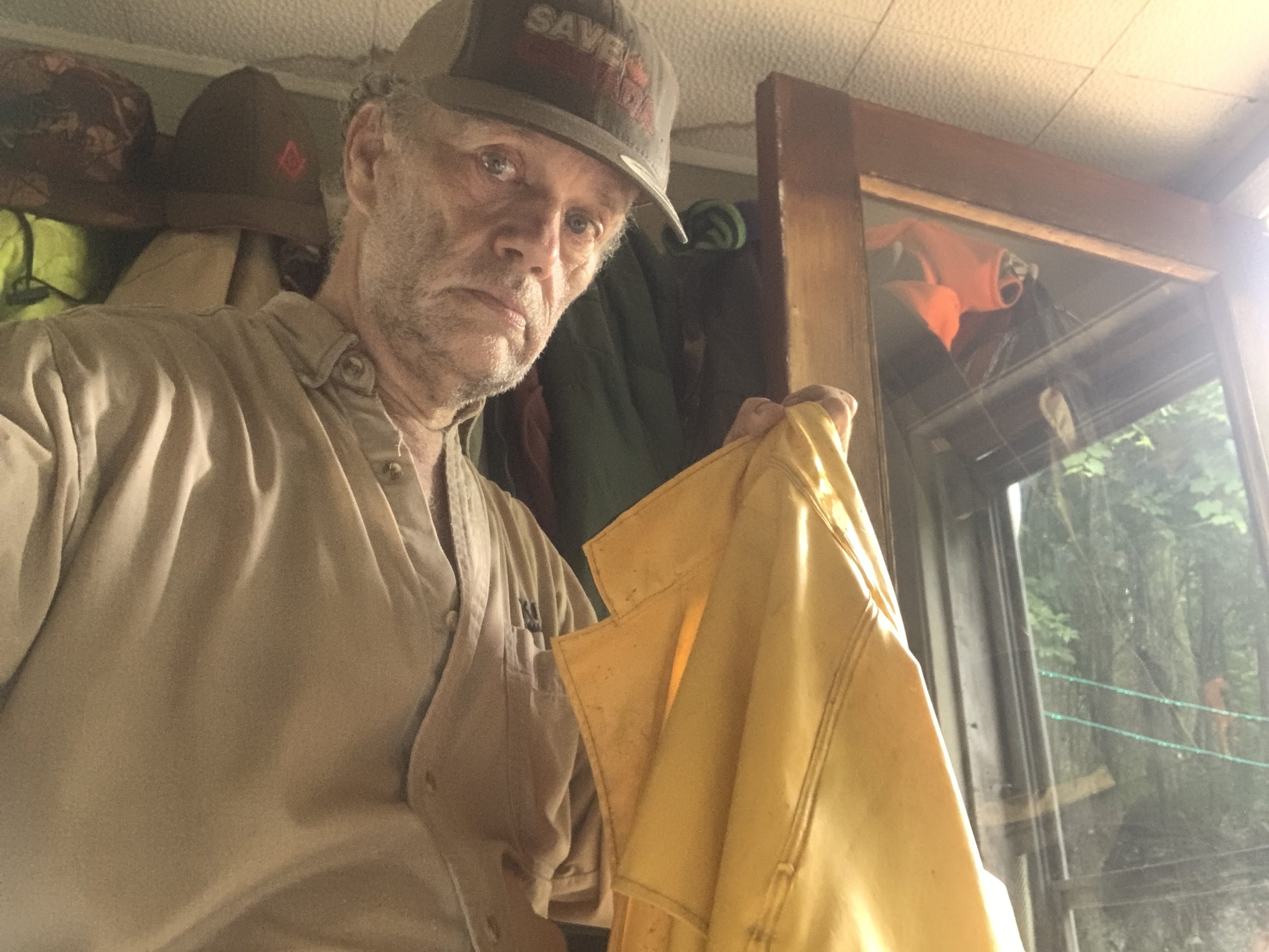 Rainy Day Chores; A picture of Brian returning totally soaked after doing chores on a rainy day!